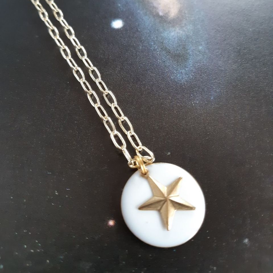 lucky brass star pendant with white enamel disc