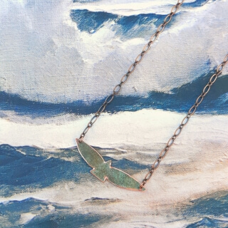 call of the wild bird necklace on seascape