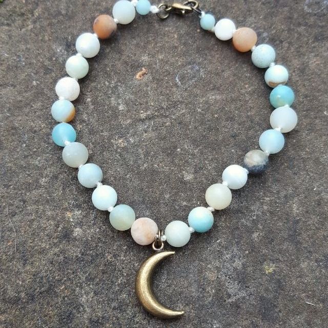 amazonite crescent moon bracelet on stone