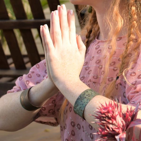 prayer pose with cuff bracelet in copper