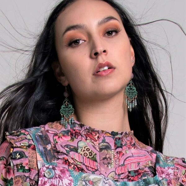 muse wears romantic verdigris chandelier earrings