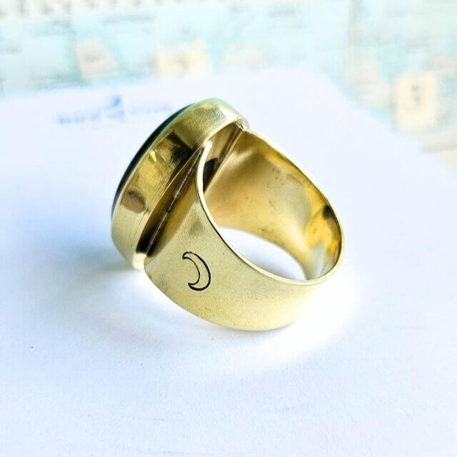 oval brass ring with moon stamped band